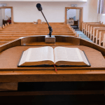 An open Bible on a pulpit — the most political book on earth